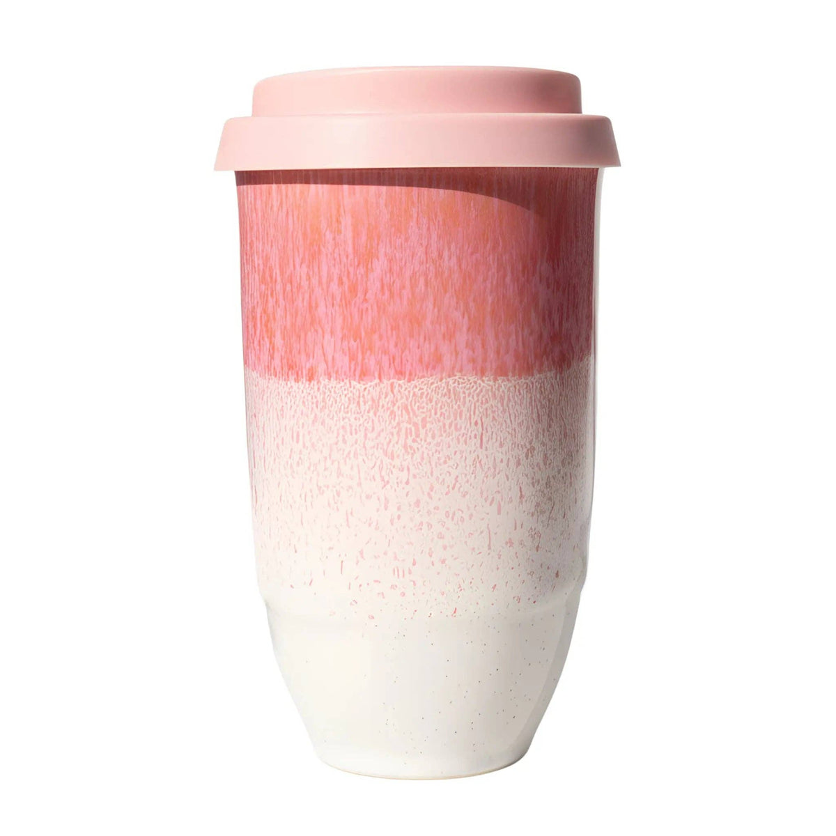 A reusable ceramic travel mug with a light pink lid, featuring a two-tone design with a textured pink upper half and a speckled white lower half.