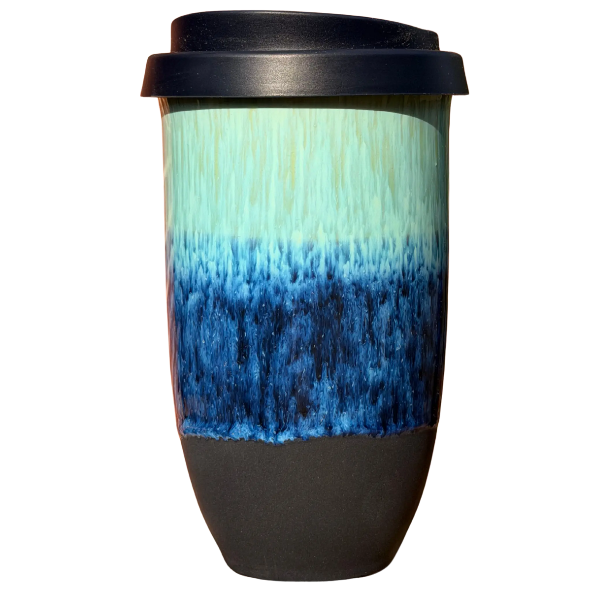 A ceramic travel mug with a black lid, featuring a glazed body with a vertical gradient transitioning from light mint green at the top to vibrant blue at the bottom, and a matte black base.