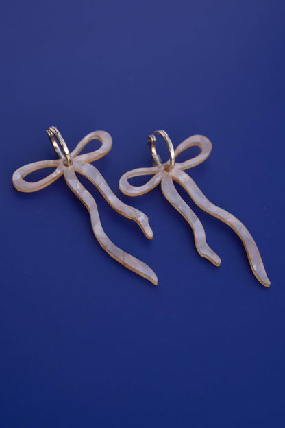 Pearlescent Beige Dangly Bow Hoop Earrings