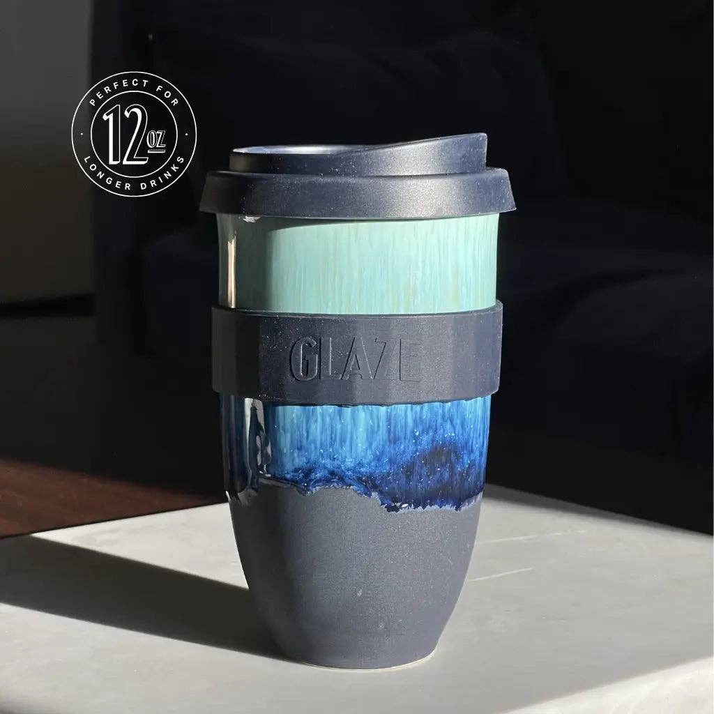 Blue and gray tumbler with GLAZE branding on a dark background