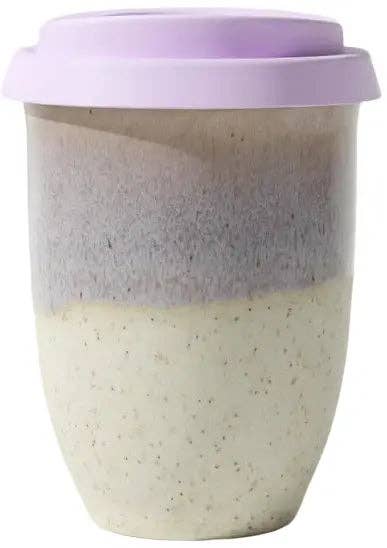 A reusable ceramic travel mug with a light purple lid, featuring a two-tone body with a speckled cream lower half and a smooth lavender upper half.