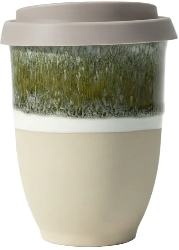 A reusable ceramic travel mug with a gray lid, featuring a textured green and white upper section and a solid beige lower section.